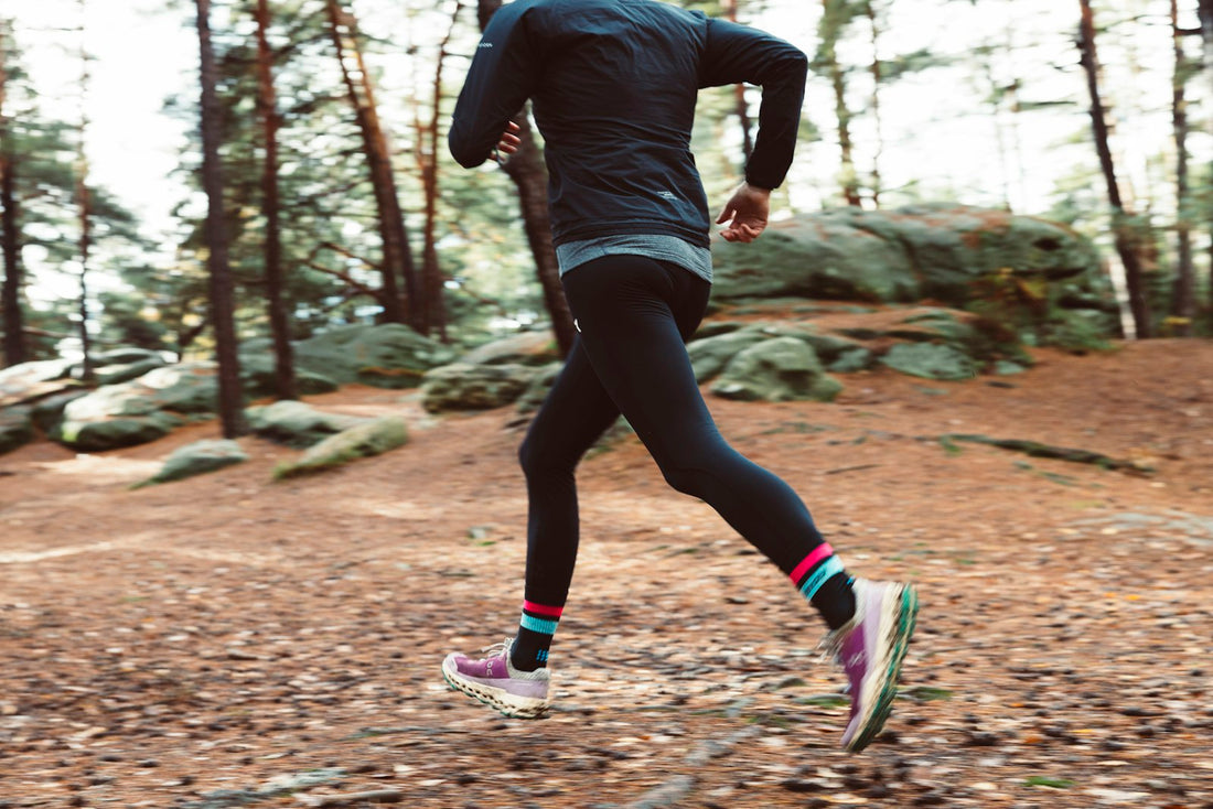 Person trail running outdoors in spring