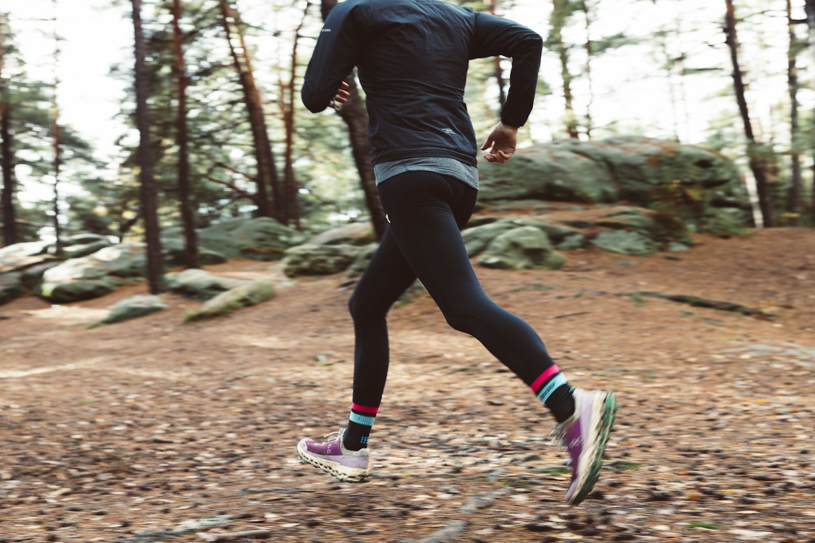 Person trail running outdoors in spring