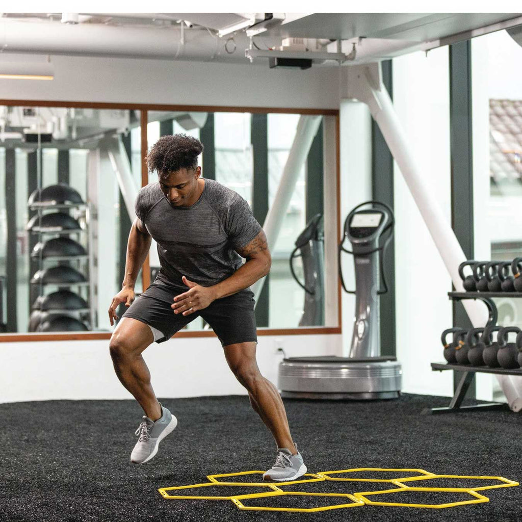 Athlete training on the SKLZ Speed Web grid in a gym