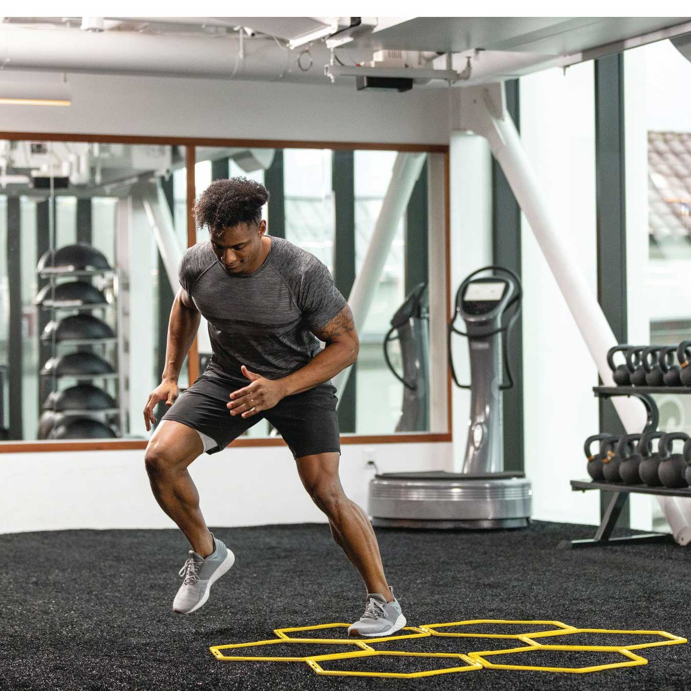 Athlete training on the SKLZ Speed Web grid in a gym