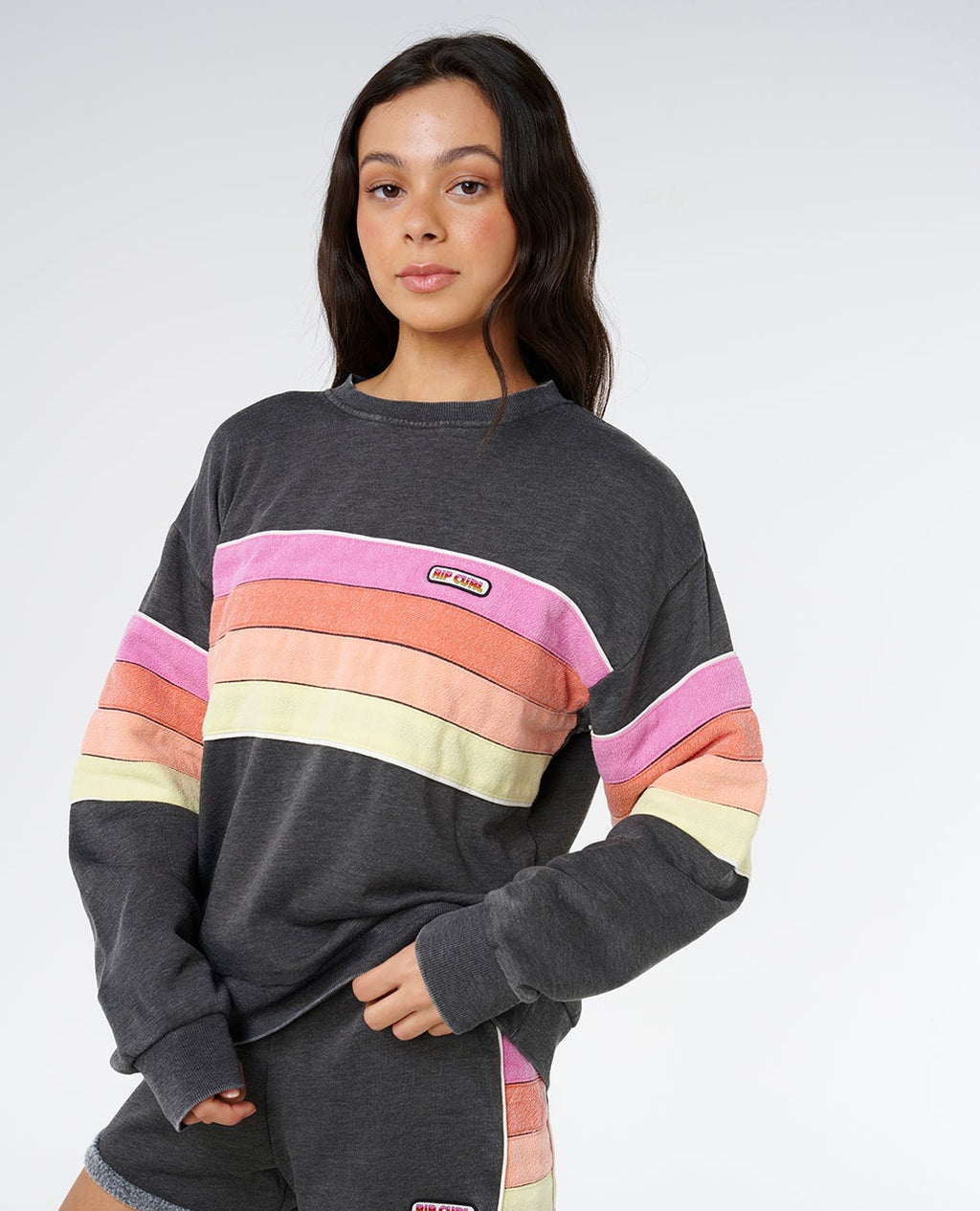 Rip Curl Women's Surf Revival Relaxed Crewneck in Washed Black, badge detail