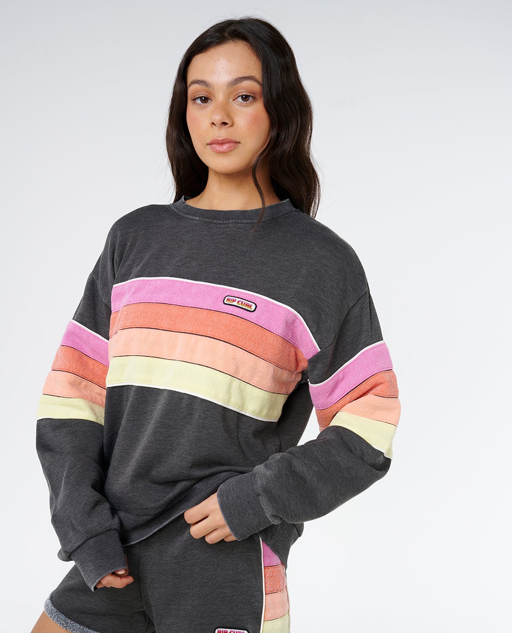 Rip Curl Women's Surf Revival Relaxed Crewneck in Washed Black, badge detail