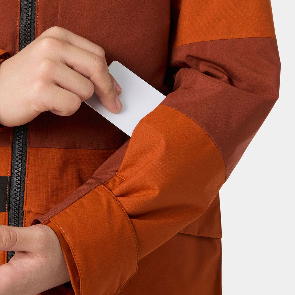 Helly Hansen Juniors' Summit 2.0 Jacket, Iron Oxide, sleeve pocket detail