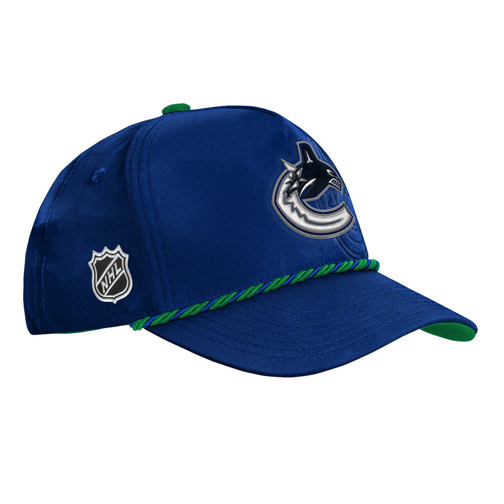 Outerstuff Vancouver Canucks 2026 NHL Draft Podium Youth Hat - three-quarter right with NHL shield
