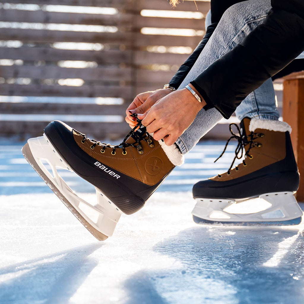 Bauer Senior Whistler 2.0 Recreational Ice Skates - Grey/Tan, lifestyle view on an outdoor rink