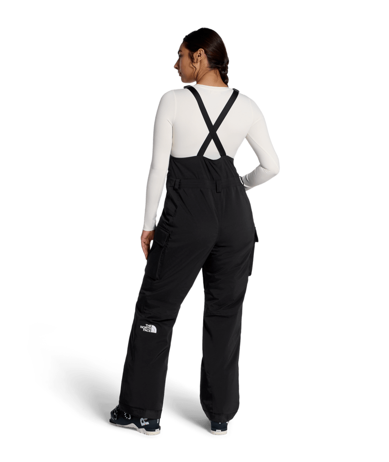The North Face Women's Freedom Insulated Bib in TNF Black, on model back