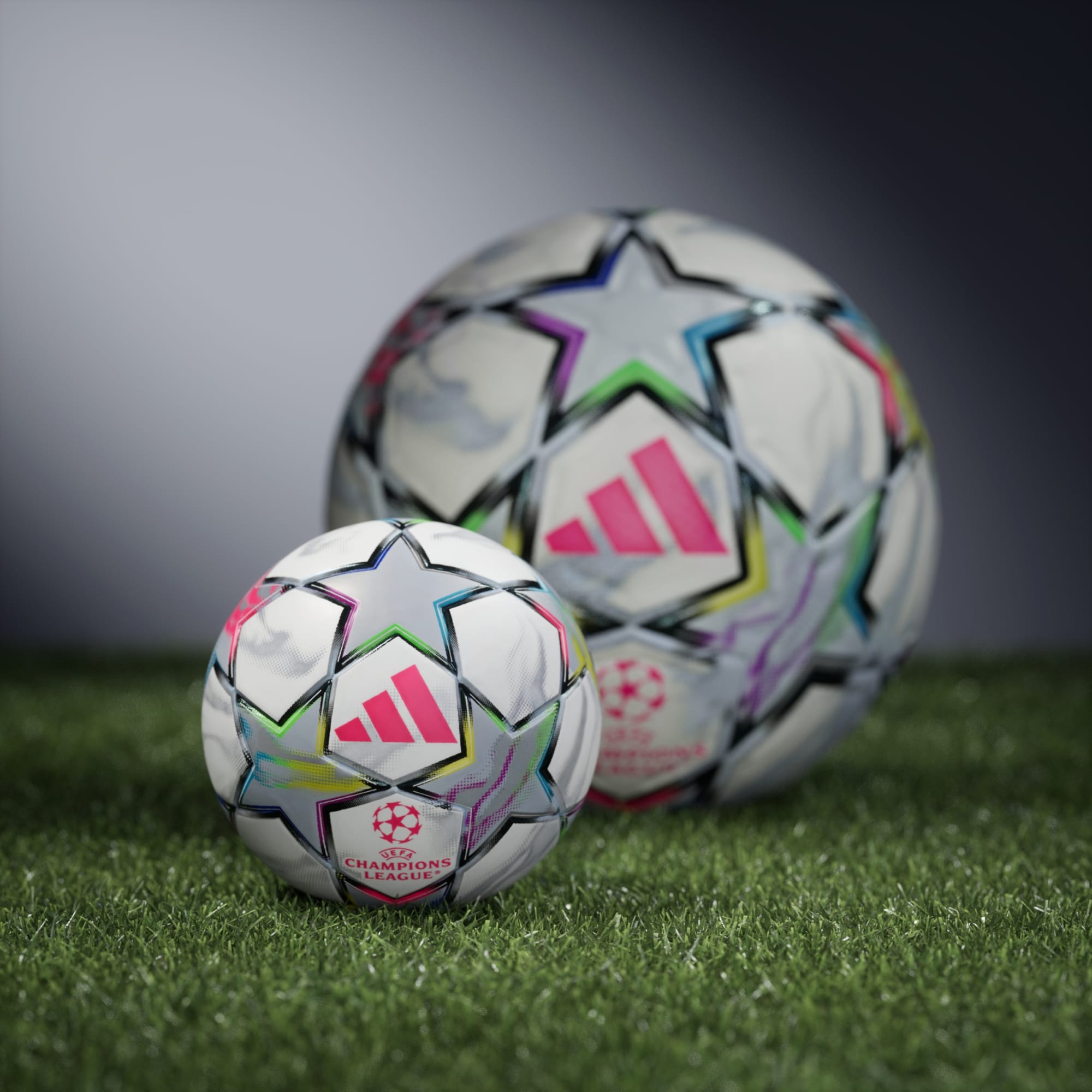 Adidas UEFA Champions League 26/27 Mini Soccer Ball White/Multicolour - shown beside the full-size ball