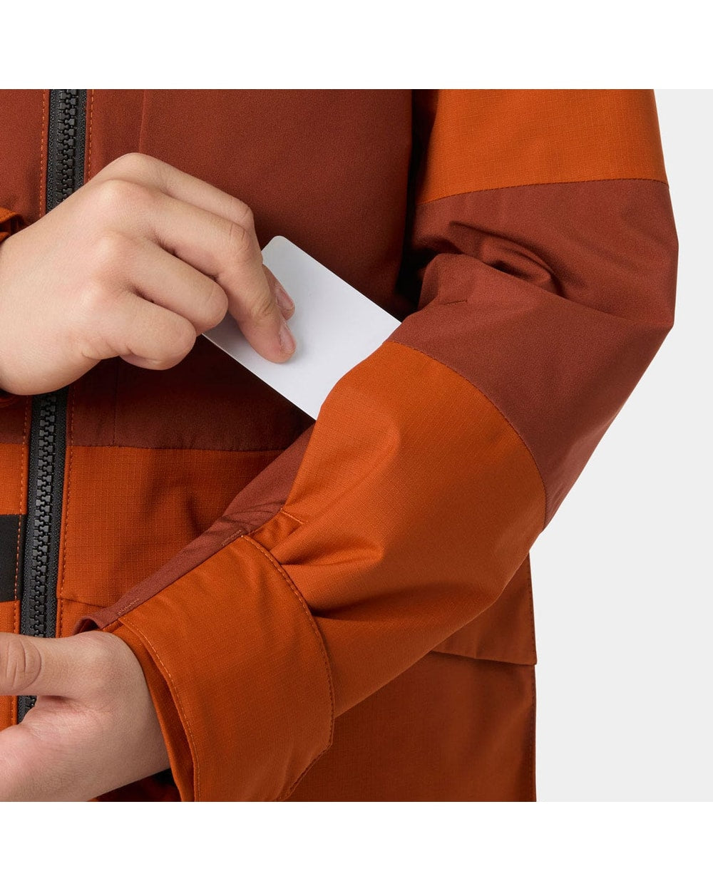 Helly Hansen Juniors' Summit 2.0 Jacket, Iron Oxide, sleeve pocket detail