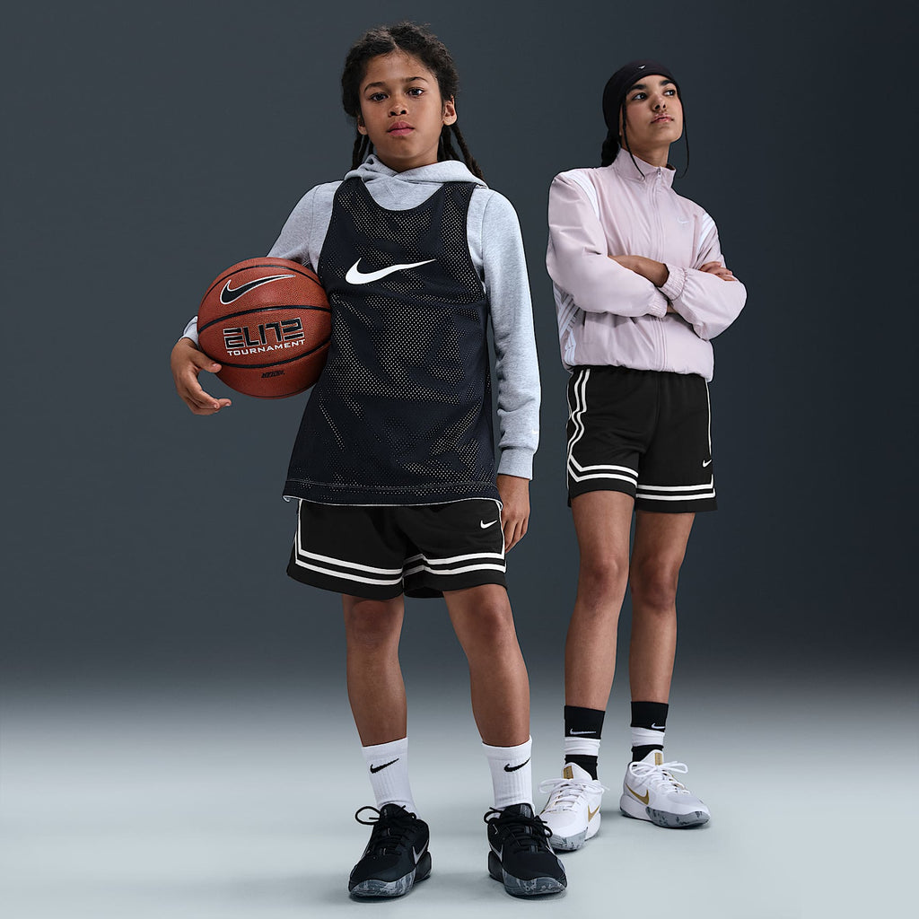 Nike Big Kids' Crossover Dri-FIT 5" Basketball Shorts in Black/Black/White - on model