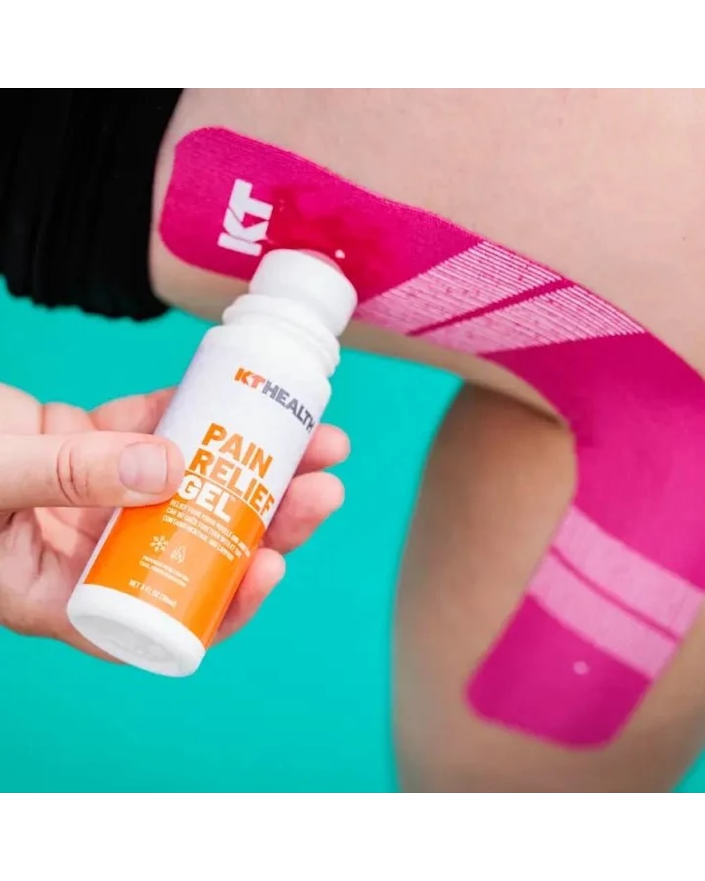 KT Health Pain Relief Roll-On Gel being applied alongside KT Tape
