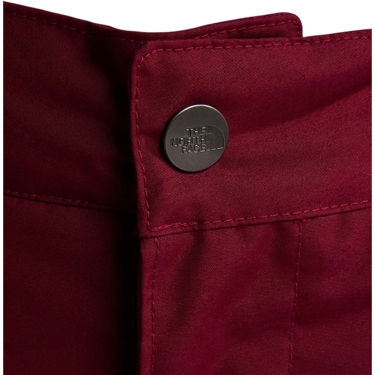 The North Face Girls' Freedom Insulated Pant in Burgundy Crush, waist snap detail
