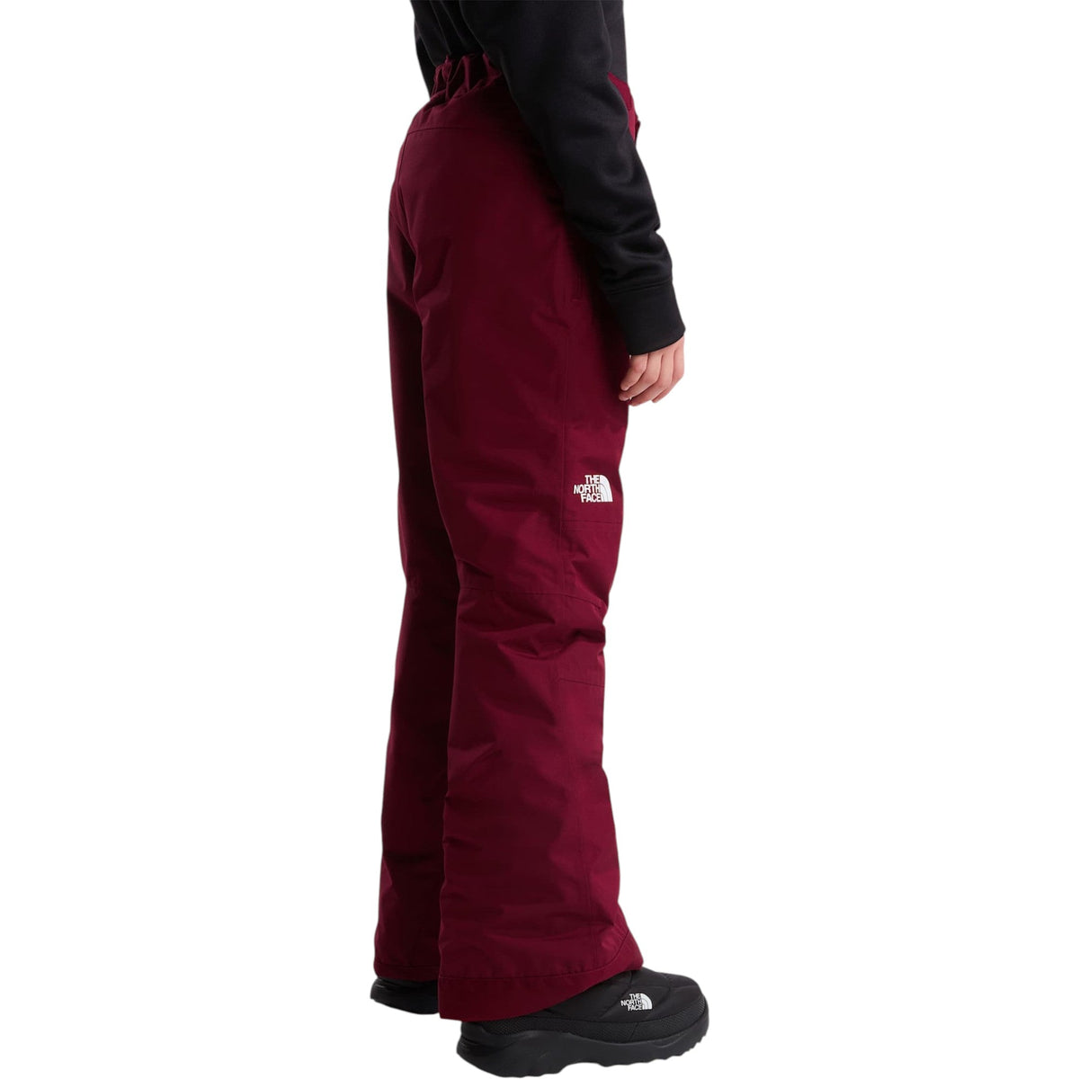 The North Face Girls' Freedom Insulated Pant in Burgundy Crush, back on model
