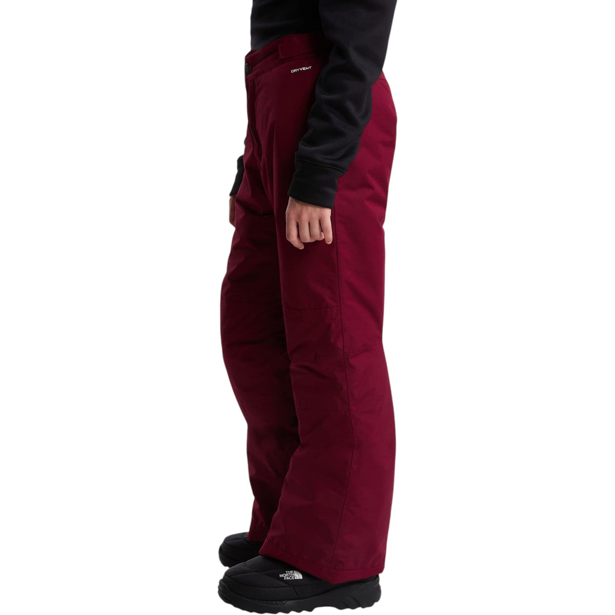 The North Face Girls' Freedom Insulated Pant in Burgundy Crush, side on model