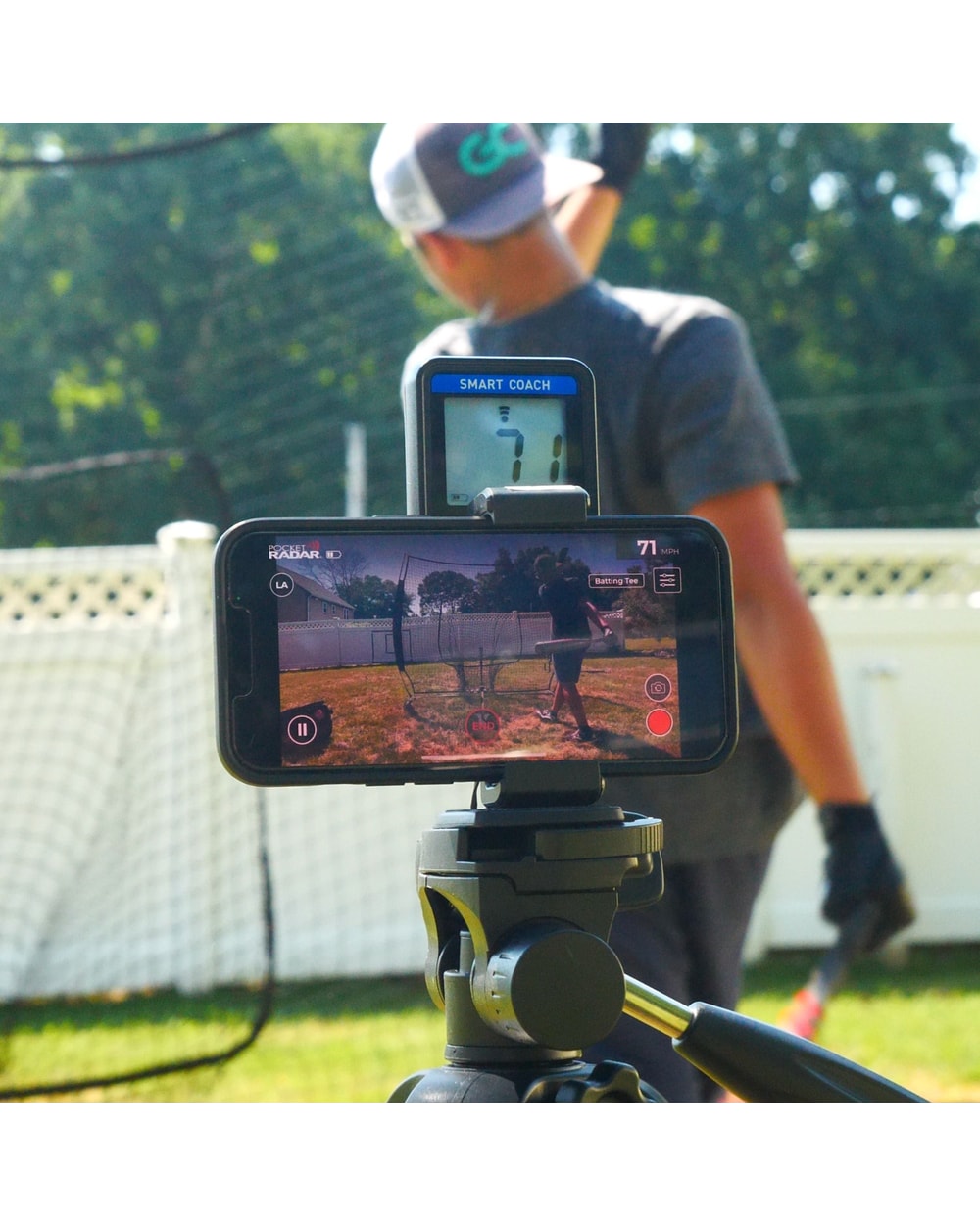 Pocket Radar Smart Coach mounted on a tripod with a phone recording a hitter