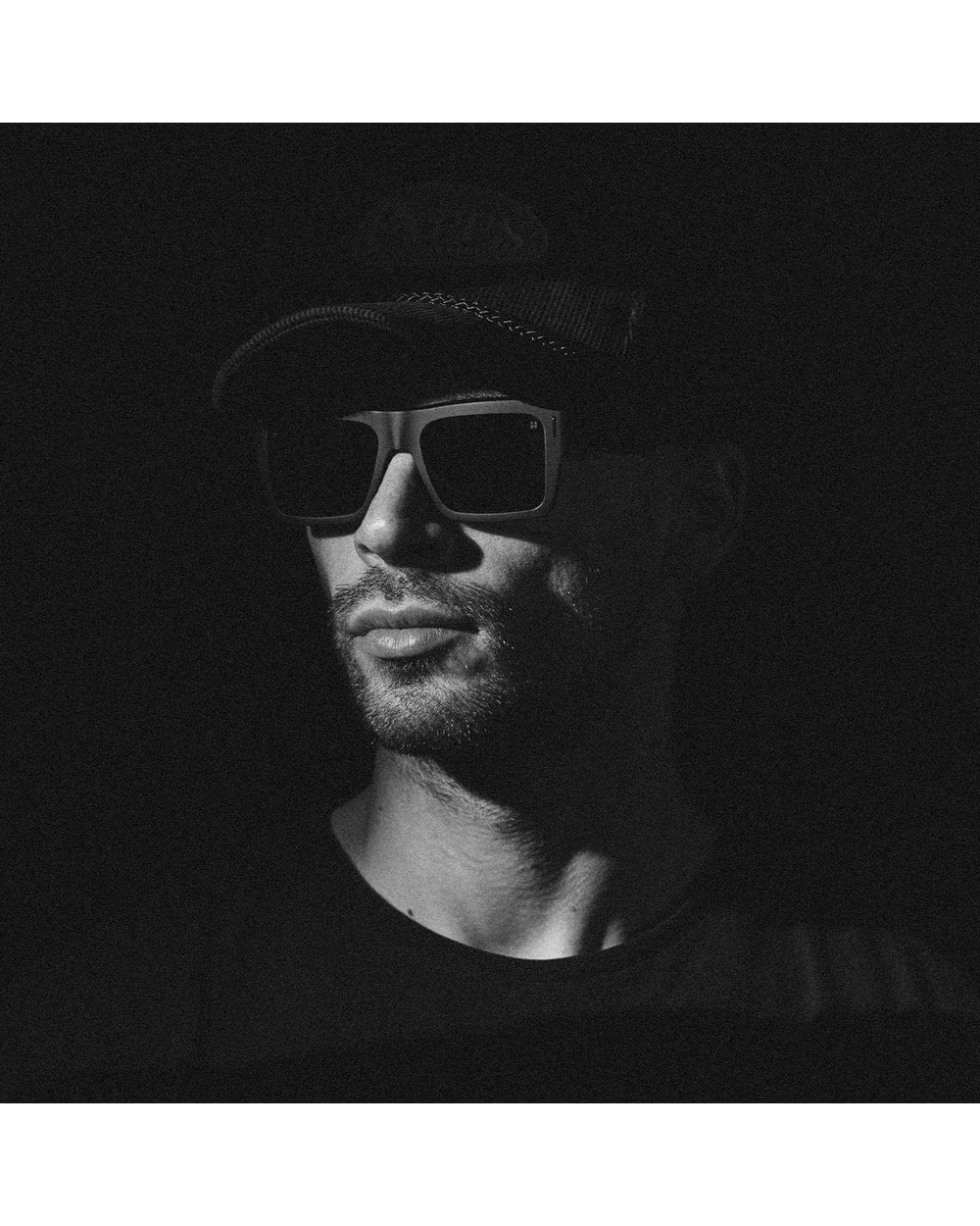Spy Bowery sunglasses, Black Happy/Black Out colourway, on-model side view